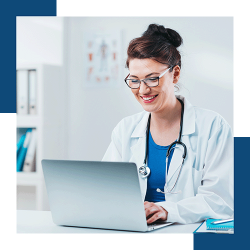 happy-female-physician-behind-computer